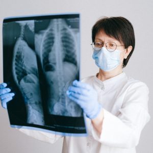 doctor examining spinal cord injury