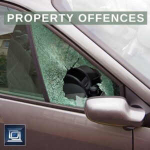 smashed car window resulting from property offences